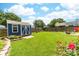 Cozy shed surrounded by a lush green lawn with space for activities at 4469 Greystone Sw Dr, Concord, NC 28027