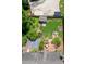 Aerial view of backyard, featuring a sports court and well manicured lawn at 4469 Greystone Sw Dr, Concord, NC 28027