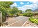 Backyard basketball court with landscaping, offering space for recreation and outdoor activities at 4469 Greystone Sw Dr, Concord, NC 28027