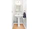 Bathroom featuring a pedestal sink, modern faucet, a square mirror and a towel at 4469 Greystone Sw Dr, Concord, NC 28027