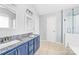 Bathroom featuring a granite countertop vanity with dual sinks, and tiled floor at 4469 Greystone Sw Dr, Concord, NC 28027