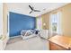 Cozy bedroom with ample natural light, a ceiling fan, and neutral carpeting at 4469 Greystone Sw Dr, Concord, NC 28027
