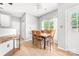 Bright dining room with hardwood floors, table with seating, and a window with natural light at 4469 Greystone Sw Dr, Concord, NC 28027