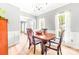 Formal dining room featuring hardwood floors, wainscoting, chandelier, and natural light at 4469 Greystone Sw Dr, Concord, NC 28027