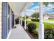 View of the front porch with a cozy chair, neat landscaping, and neighborhood view at 4469 Greystone Sw Dr, Concord, NC 28027