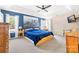 Large main bedroom with a scenic wall, ceiling fan, and neutral carpet at 4469 Greystone Sw Dr, Concord, NC 28027