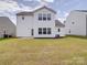 Expansive backyard features a well-maintained lawn, patio area, and privacy landscaping at 5121 Arbordale Way, Mount Holly, NC 28120