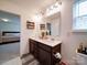 Bright bathroom with double vanity and view to the bedroom at 5121 Arbordale Way, Mount Holly, NC 28120
