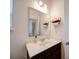 Bathroom vanity, mirror, and lighting at 5121 Arbordale Way, Mount Holly, NC 28120