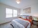 Comfortable bedroom with decorative pillows, gray accents, and natural light from window at 5121 Arbordale Way, Mount Holly, NC 28120