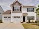 Charming two-story home with a two-car garage, nicely landscaped yard, and lovely curb appeal at 5121 Arbordale Way, Mount Holly, NC 28120