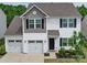 Charming two-story home with a two-car garage, nicely landscaped yard, and lovely curb appeal at 5121 Arbordale Way, Mount Holly, NC 28120