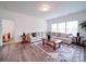 Comfortable living room with a plush sectional sofa, a decorative rug, and ample natural light at 5121 Arbordale Way, Mount Holly, NC 28120