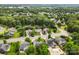 An aerial view of a neighborhood with tree lined streets and well maintained homes at 5707 Sustar Dr, Monroe, NC 28110