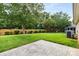 A well maintained backyard featuring a patio and lush green grass at 5707 Sustar Dr, Monroe, NC 28110