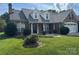 Well maintained brick home with a manicured lawn and tidy landscaping at 5707 Sustar Dr, Monroe, NC 28110