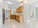 Well-lit kitchen with wooden cabinets and a doorway leading to another room at 5707 Sustar Dr, Monroe, NC 28110