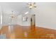 Bright living room featuring hardwood floors, high vaulted ceilings, and a chandelier at 5707 Sustar Dr, Monroe, NC 28110