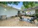 Wooden deck with chairs and string lights, great for outdoor entertaining at 6215 Cross Creek Ln, Charlotte, NC 28212