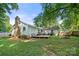 Backyard with wooden deck and lush green lawn at 6215 Cross Creek Ln, Charlotte, NC 28212