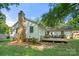 This home has a charming backyard, deck, brick chimney, and plenty of sunlight at 6215 Cross Creek Ln, Charlotte, NC 28212