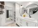 Bright bathroom with double vanity, vessel sinks, and decorative mirrors at 6215 Cross Creek Ln, Charlotte, NC 28212