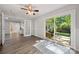 Bonus room with French doors to backyard, ceiling fan, and view into living spaces at 6215 Cross Creek Ln, Charlotte, NC 28212