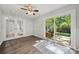 Bonus room featuring a ceiling fan, luxury vinyl plank flooring, and French doors leading to the backyard at 6215 Cross Creek Ln, Charlotte, NC 28212