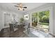 Bright dining area with deck access, complemented by modern decor and elegant touches at 6215 Cross Creek Ln, Charlotte, NC 28212