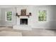 Bright white fireplace in a sun-filled living room with a decorative mantle and bright double-hung windows at 6215 Cross Creek Ln, Charlotte, NC 28212