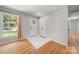 Welcoming foyer with hardwood floors, a window, and white doors at 6215 Cross Creek Ln, Charlotte, NC 28212
