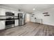 The updated kitchen is airy and bright with new stainless steel appliances at 6215 Cross Creek Ln, Charlotte, NC 28212