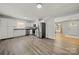 Bright kitchen features stainless appliances, white cabinets, and wood grain flooring at 6215 Cross Creek Ln, Charlotte, NC 28212
