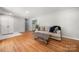 Bright living room featuring wood floors, a modern sofa, and ample natural light at 6215 Cross Creek Ln, Charlotte, NC 28212