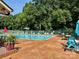 Enjoy community amenities, like this swimming pool with plenty of lounging room and mature landscaping at 6215 Cross Creek Ln, Charlotte, NC 28212