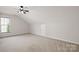 Spacious bonus room with a ceiling fan and lots of light at 6803 Augustine Way, Charlotte, NC 28270