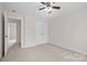Bright bedroom with ceiling fan and closet at 6803 Augustine Way, Charlotte, NC 28270