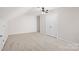 Spacious bonus room with a ceiling fan and closet at 6803 Augustine Way, Charlotte, NC 28270