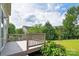 Outdoor deck area with a view of the expansive lawn and garden, perfect for relaxing and entertaining at 6803 Augustine Way, Charlotte, NC 28270
