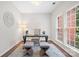 Well-lit home office space with a desk and windows at 6803 Augustine Way, Charlotte, NC 28270