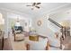 Bright living room with modern furnishings, hardwood floors, and an open layout that flows into the dining area at 6803 Augustine Way, Charlotte, NC 28270