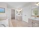 Main bathroom with a soaking tub, dual vanities, and walk-in closet at 6803 Augustine Way, Charlotte, NC 28270