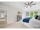 Comfortable main bedroom with ceiling fan and view of hall at 6803 Augustine Way, Charlotte, NC 28270