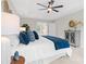 Bright and airy main bedroom features a tray ceiling and view of ensuite at 6803 Augustine Way, Charlotte, NC 28270