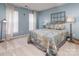 Charming bedroom with blue walls, two windows, and a stylishly decorated queen-sized bed at 7700 Antique Cir, Waxhaw, NC 28173