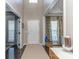 Bright foyer with a neutral rug and light walls and views of the study and dining areas at 7700 Antique Cir, Waxhaw, NC 28173