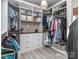 Spacious walk-in closet with custom shelving, drawers, and ample hanging space at 7700 Antique Cir, Waxhaw, NC 28173