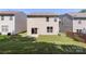 Backyard with a patio, grass, and vinyl siding on the house at 858 Rook Rd, Charlotte, NC 28216