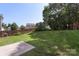 Spacious backyard featuring lush green grass and a wooden privacy fence at 858 Rook Rd, Charlotte, NC 28216