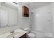 Well-lit bathroom with a combination tub and shower and a vanity at 858 Rook Rd, Charlotte, NC 28216